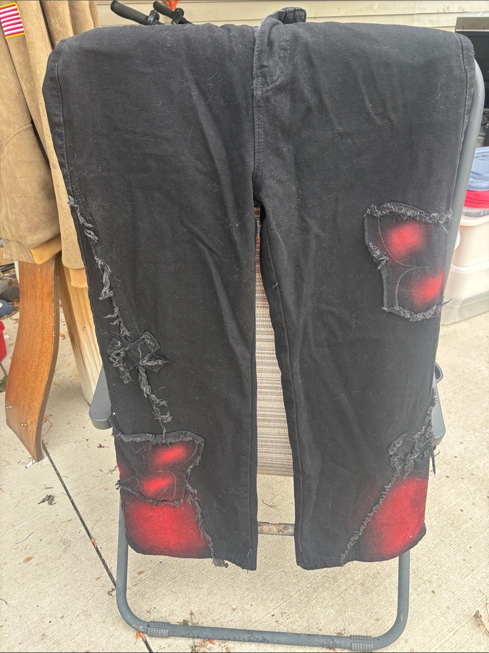 Black Distressed Women's Jeans with Red Spray Accents